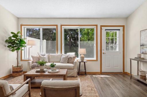 Sun-filled family room with patio access (Virtually Staged)