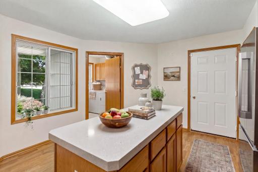 Bright eat-in kitchen overlooking backyard