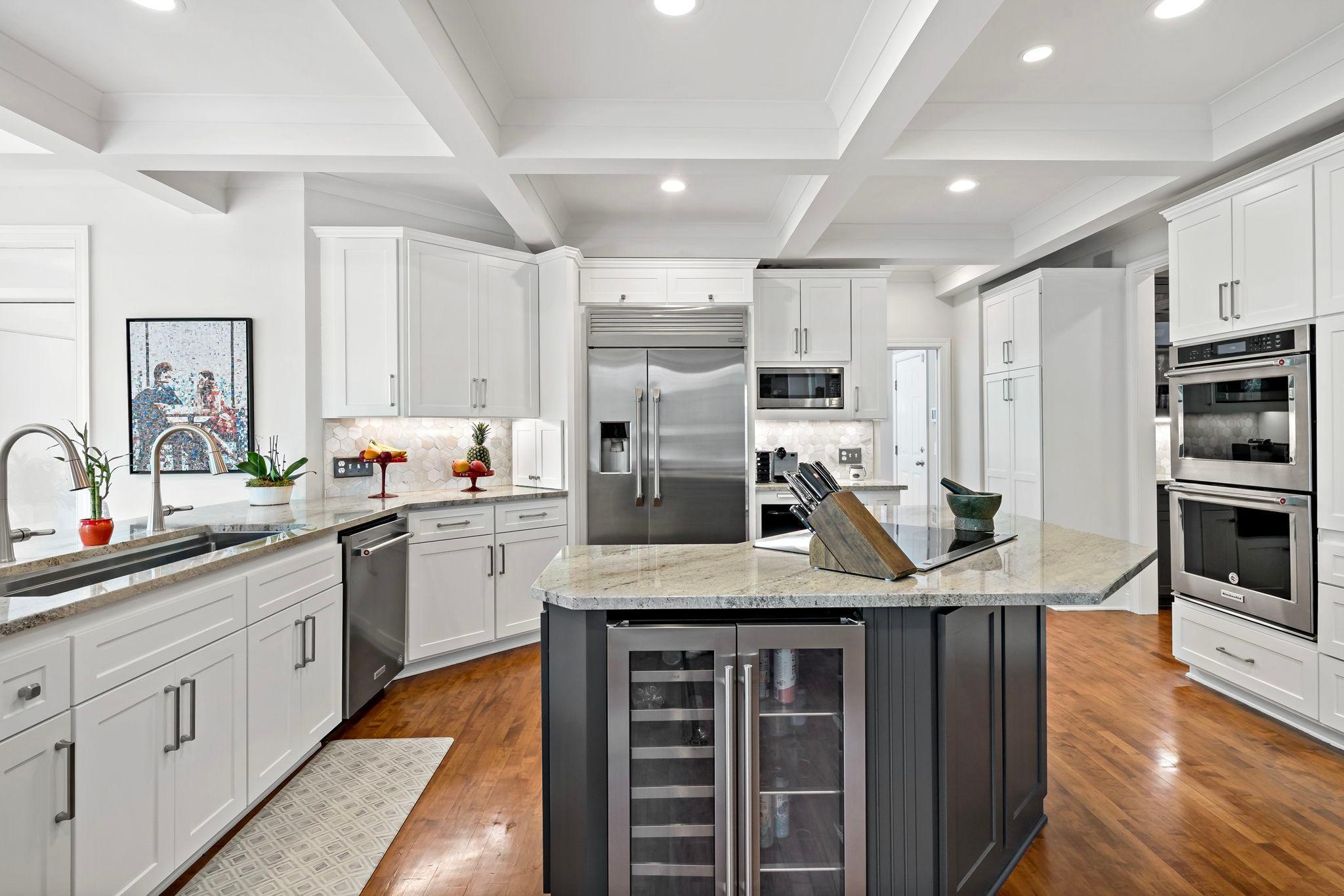 Incredible recently remodeled kitchen! Gorgeous, refaced cabinets, stunning coffered ceiling and lighting, amazing cabinet and counter space, top-line stainless appliances, and beautiful hardwood floors