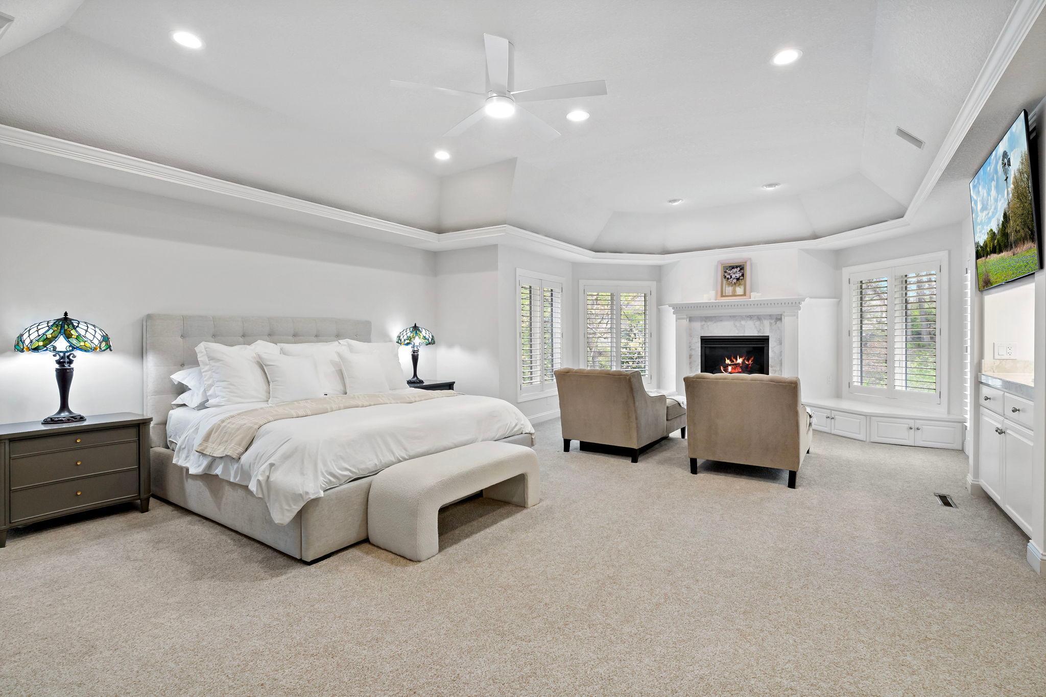 WOW! Incredible Primary suite - the largest and most luxurious primary bedroom you will find including a fireplace, in-room sink, gorgeous windows and blinds, and private deck!