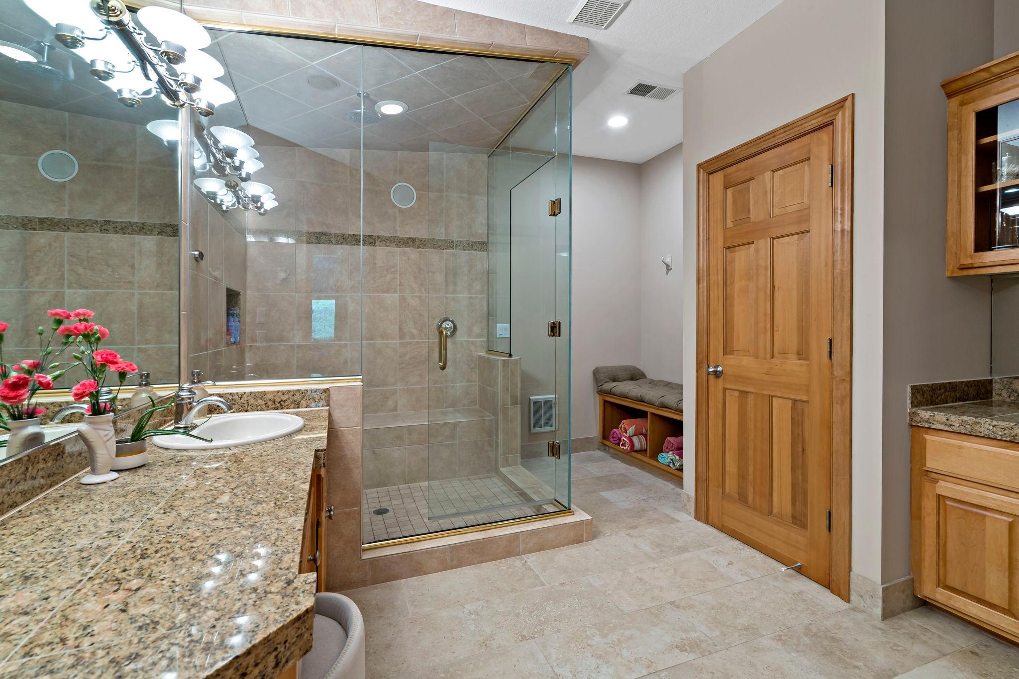 Lower level spa-like bathroom with steam shower
