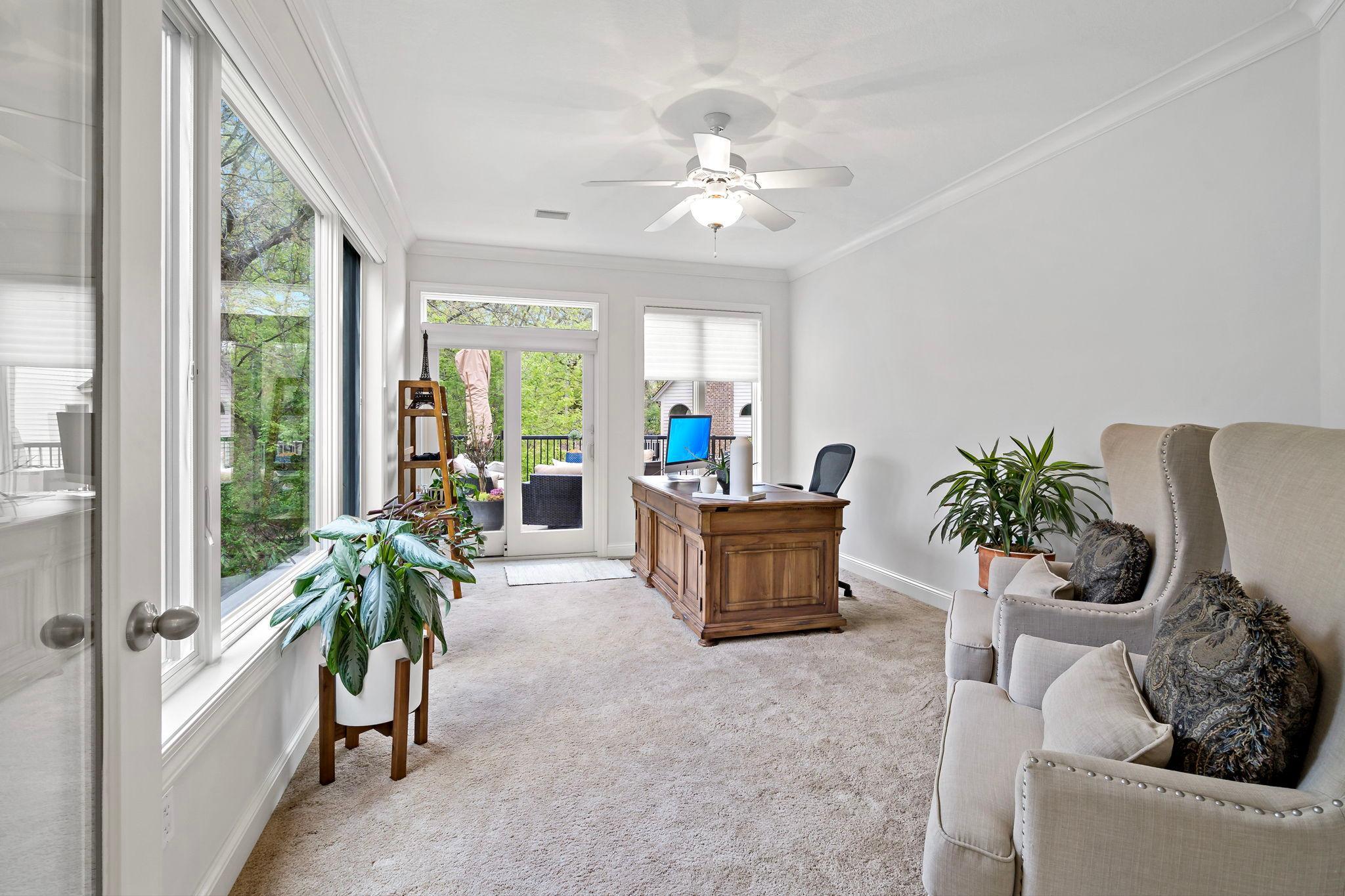 An additional main floor office or sitting area overlooking the backyard and walking out to the amazing maintenance-free deck!