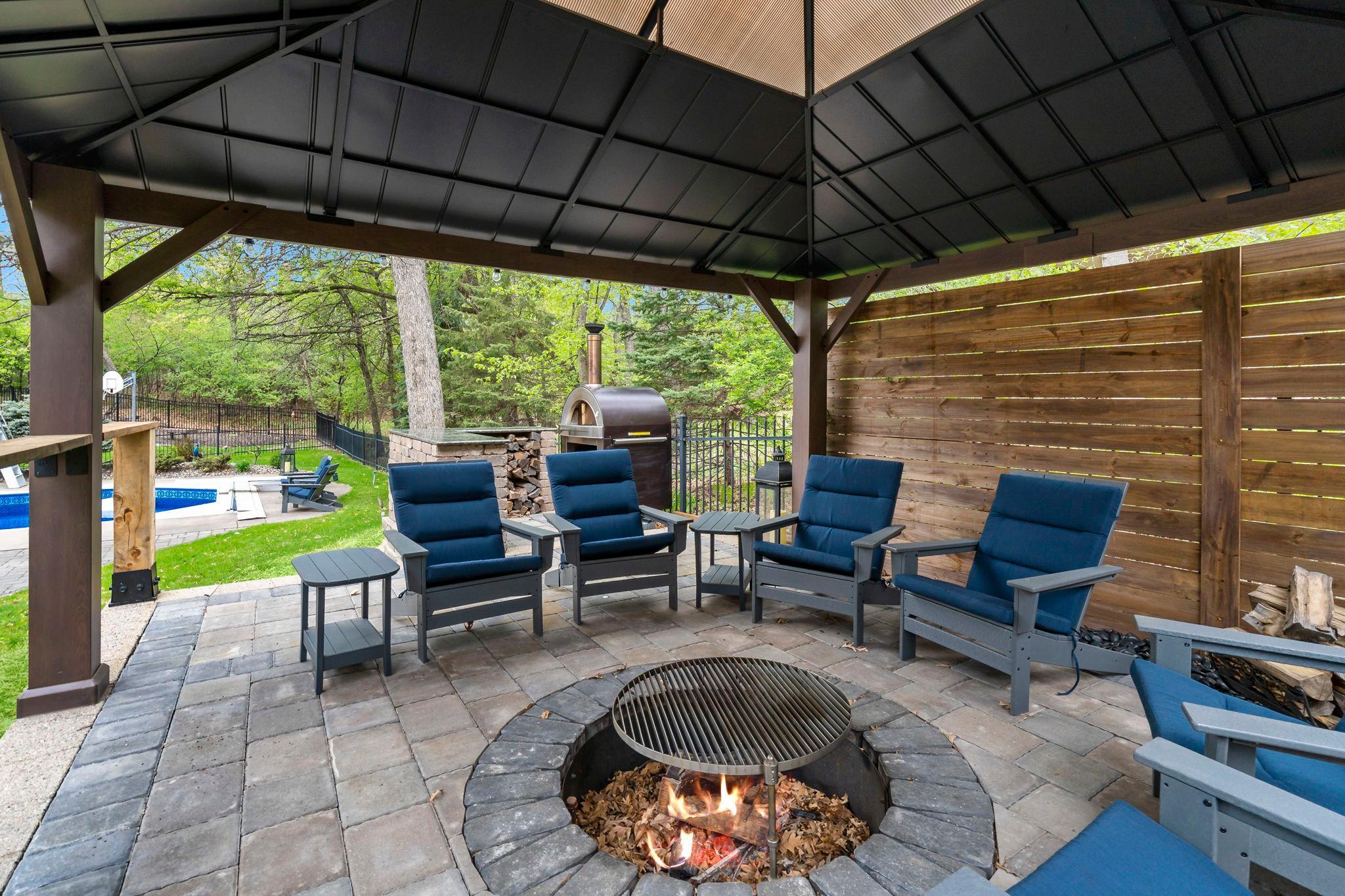 Newly built paver patio/firepit area with gazebo and amazing privacy!