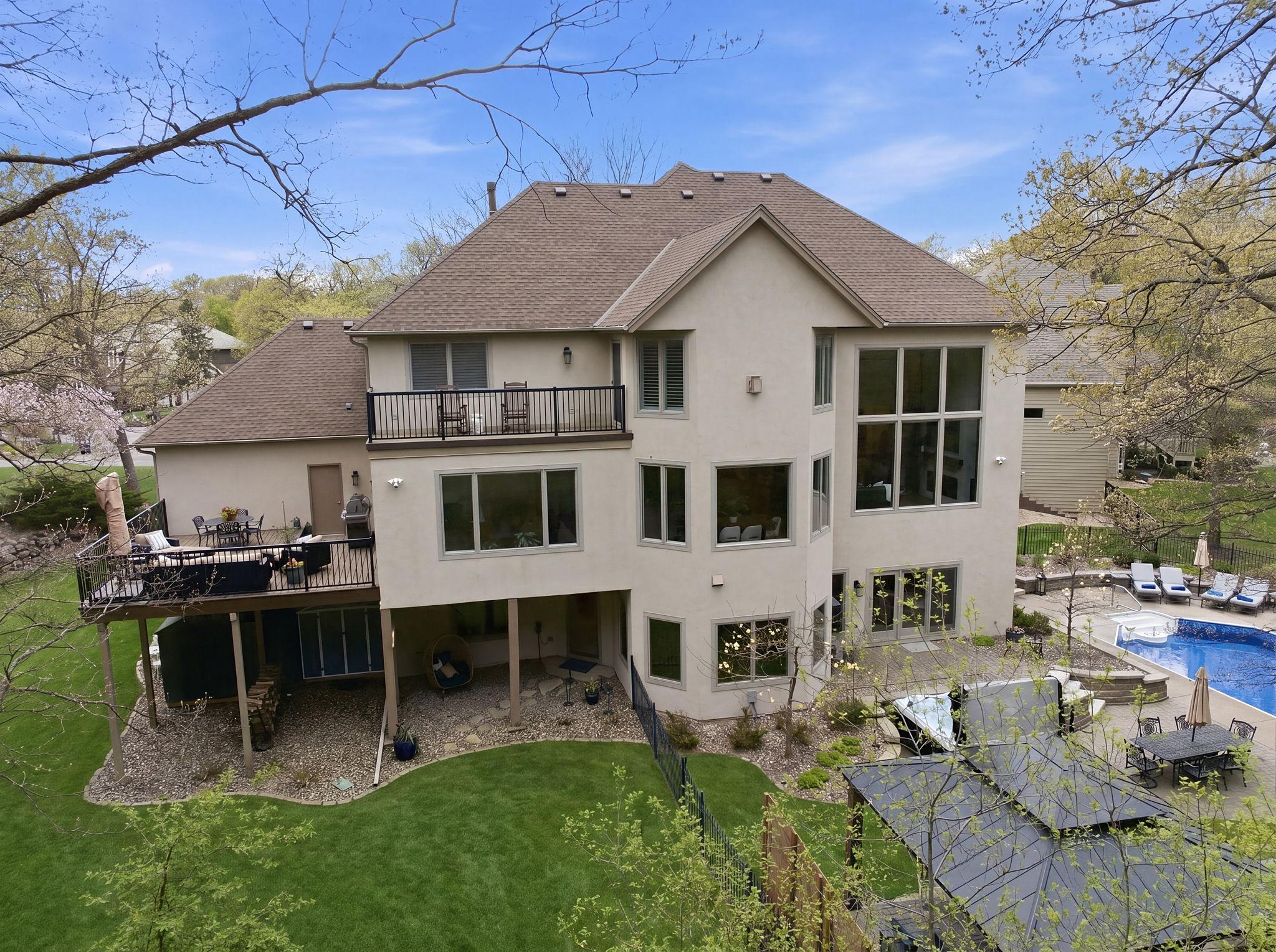 Amazing resort-like backyard with a 44x18 pool, private patio/firepit area with gazebo, a maintenance free deck, amazing landscaping, and 2 under-deck storage sheds