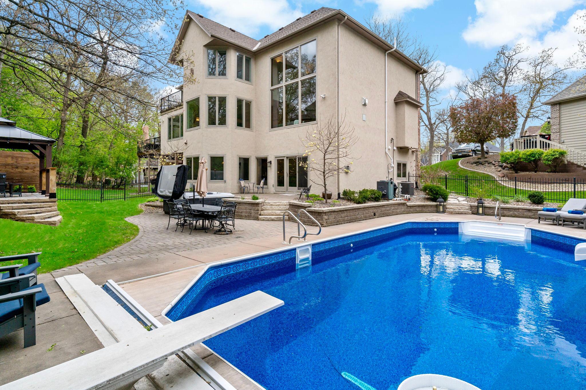 Incredible resort-style backyard with a gorgeous 44x18 pool with automatic cover, amazing professional landscaping, a newly built patio/firepit area and gazebo - amazing privacy and wildlife! Welcome to your backyard sanctuary!
