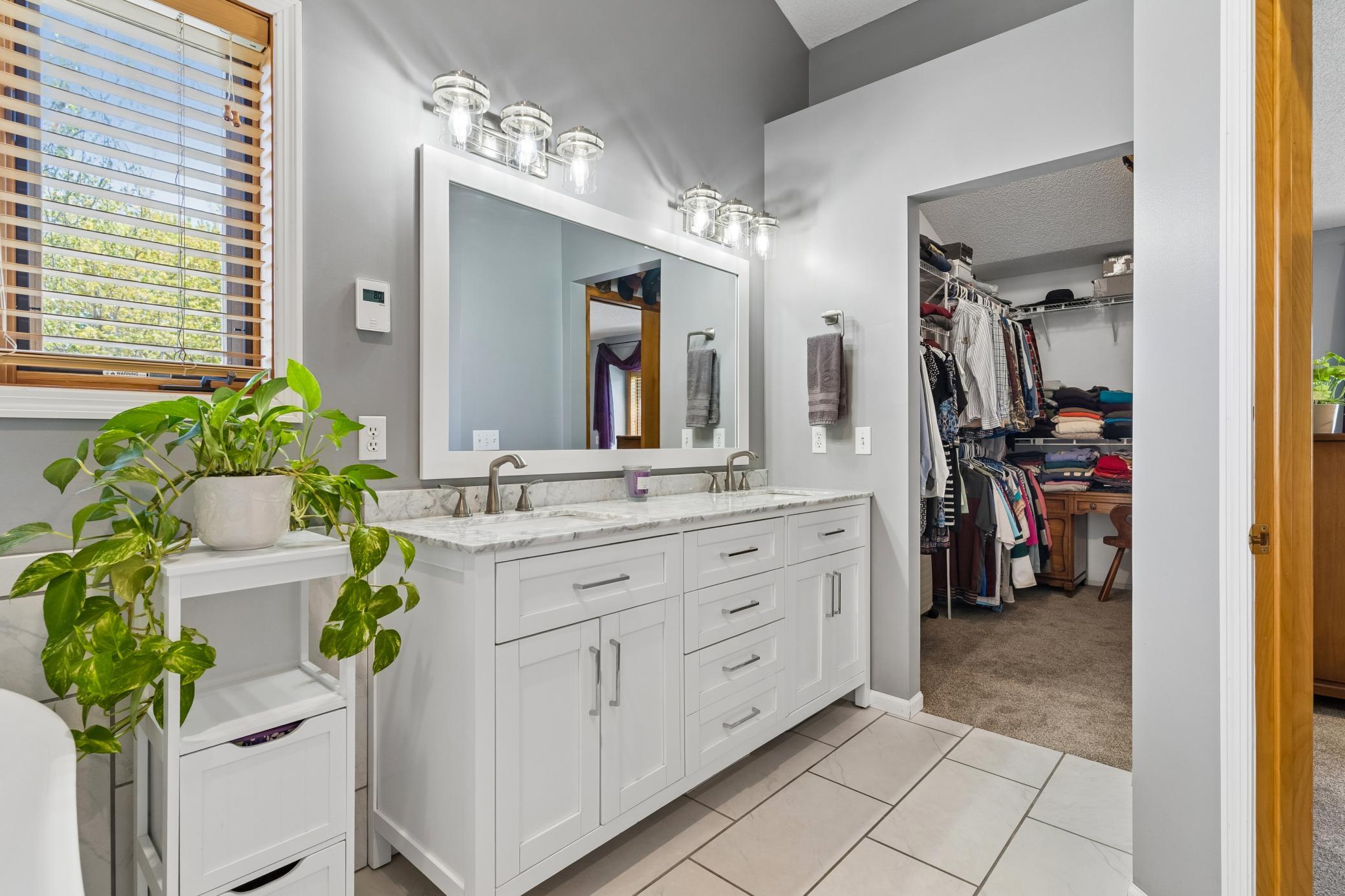 Primary Bath has double sinks, separate tub and shower.