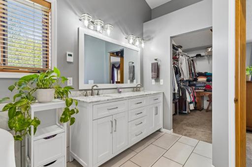 Primary Bath has double sinks, separate tub and shower.