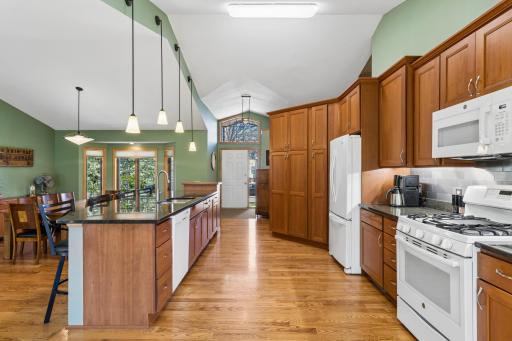 Beautiful cabinets, counters and flooring.