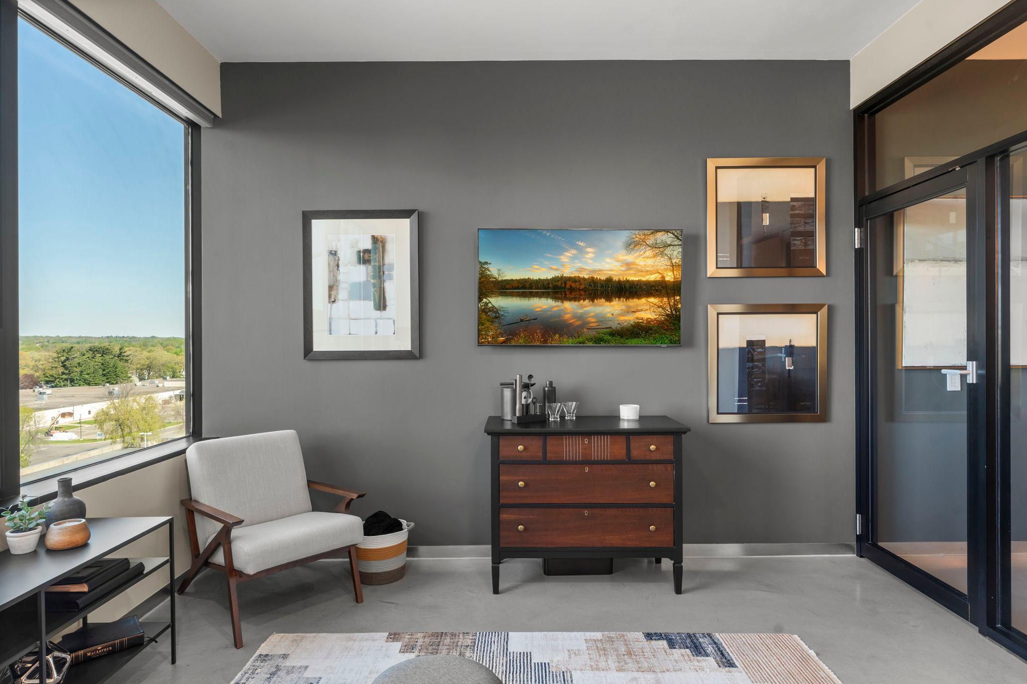 The living room opens to the bedroom through beautiful glass doors