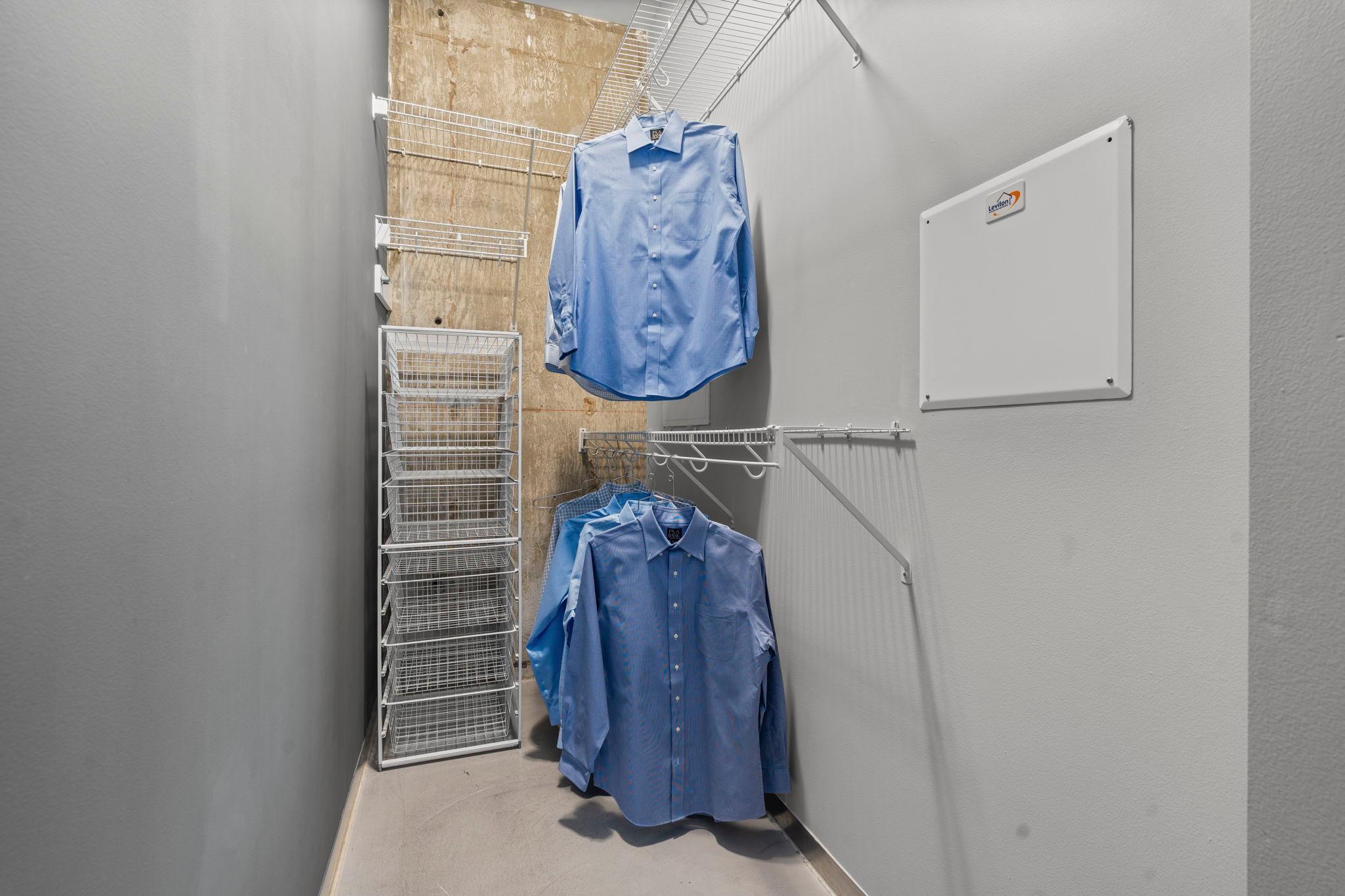 The closet offers built-in storage shelving
