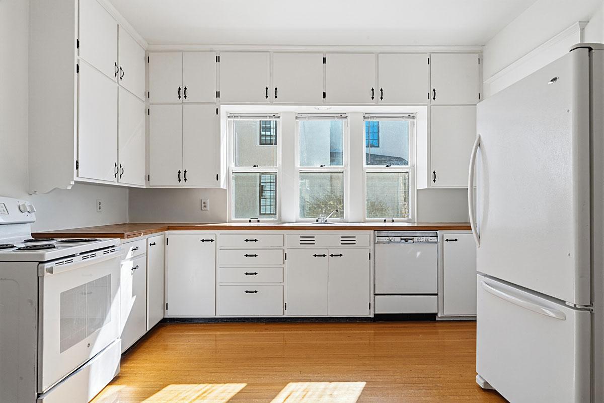 Wonderfully refreshed kitchen with. Cabinetry has been thoroughly cleaned and painted, inside and out.