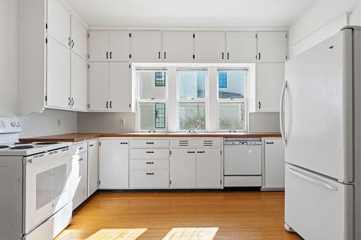 Wonderfully refreshed kitchen with. Cabinetry has been thoroughly cleaned and painted, inside and out.
