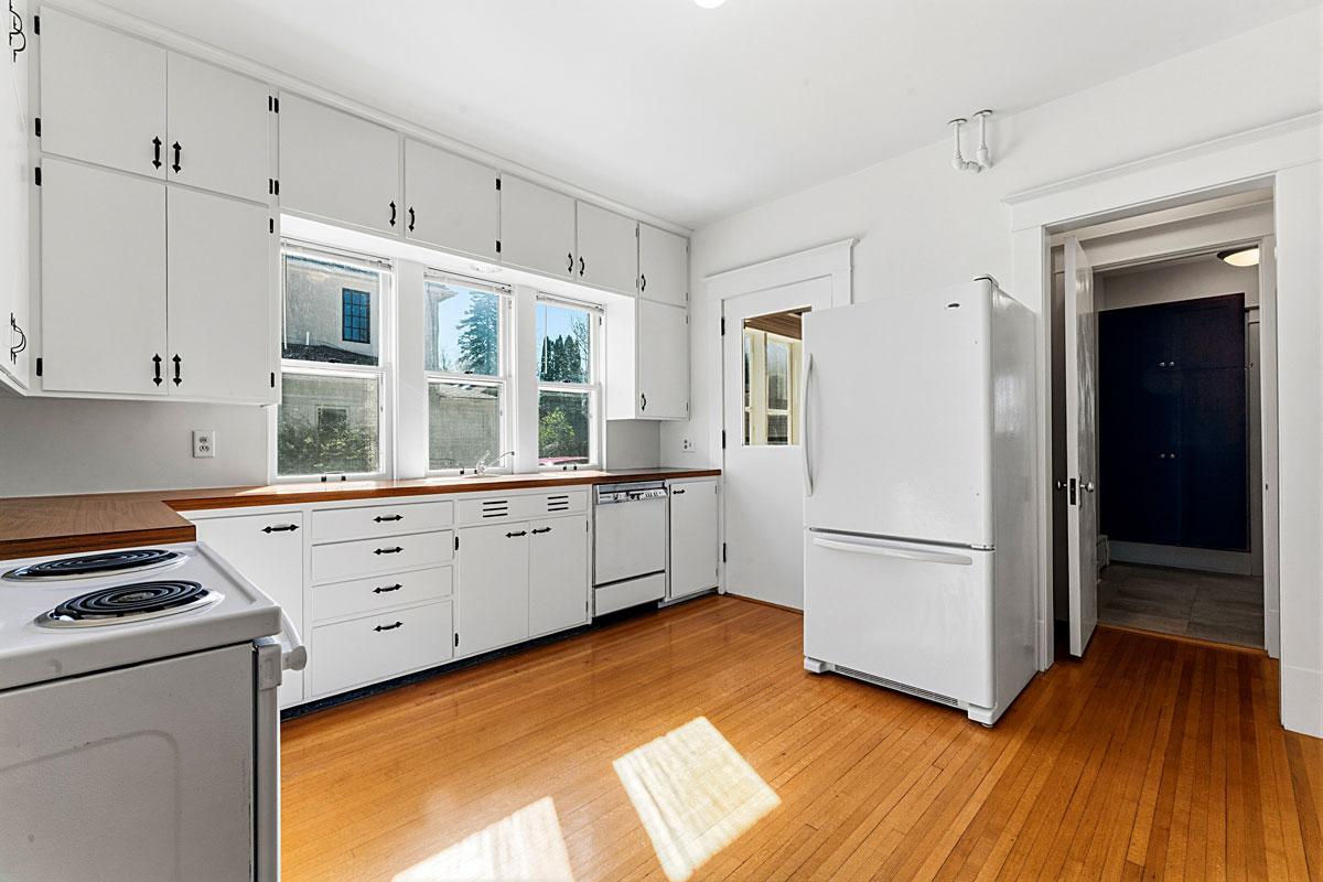 There's a 3/4 bath off the kitchen and a back porch/patio.
