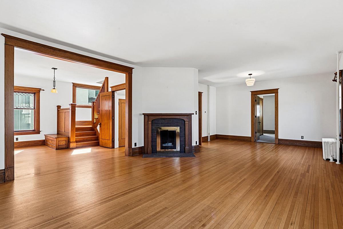 This living/dining room is all the more cozy with a wood-burning fireplace.