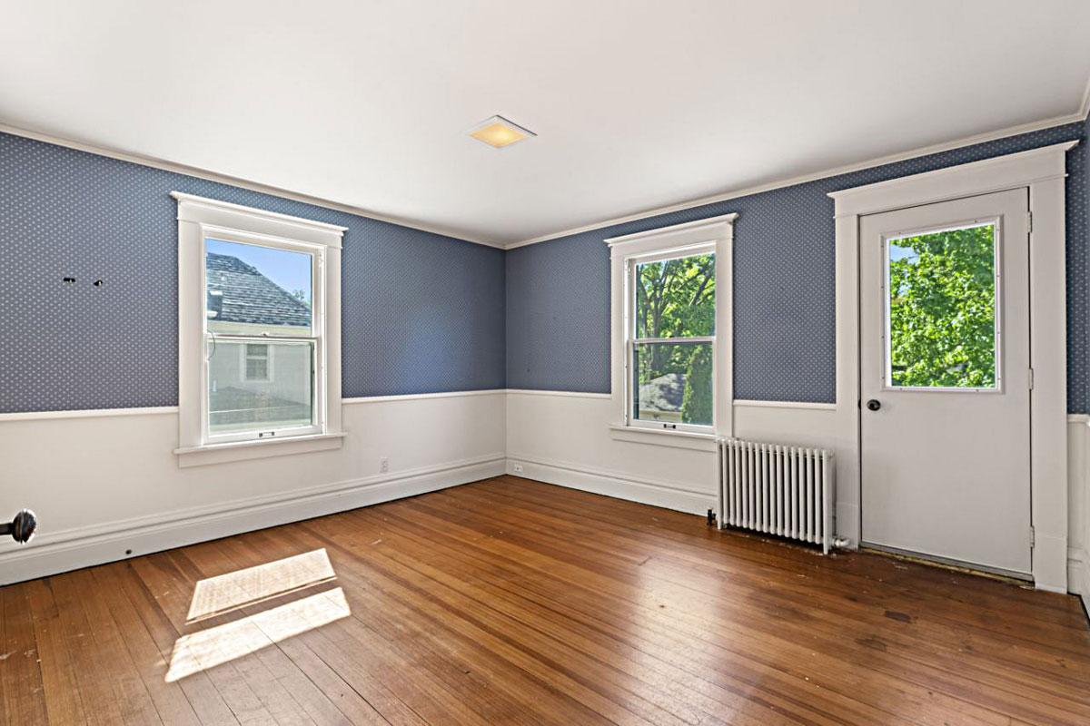 The floors have been refinished throughout the 2nd floor. This SEAMLESS Douglas Fir is amazing! This room has a walkout to a flat roof. Future deck?