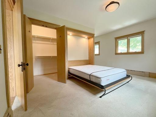 It's a murphy bed right next to a walk-in closet. This room can be a main-floor bedroom, guest room, office, or other flex purpose.