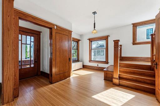 Amazing entry with grand staircase, leaded glass, cross-cut oak floors and natural woodwork.