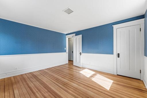 The floors have been refinished throughout the 2nd floor. This SEAMLESS Douglas Fir is amazing! This room has a walkout to a flat roof. Future deck?