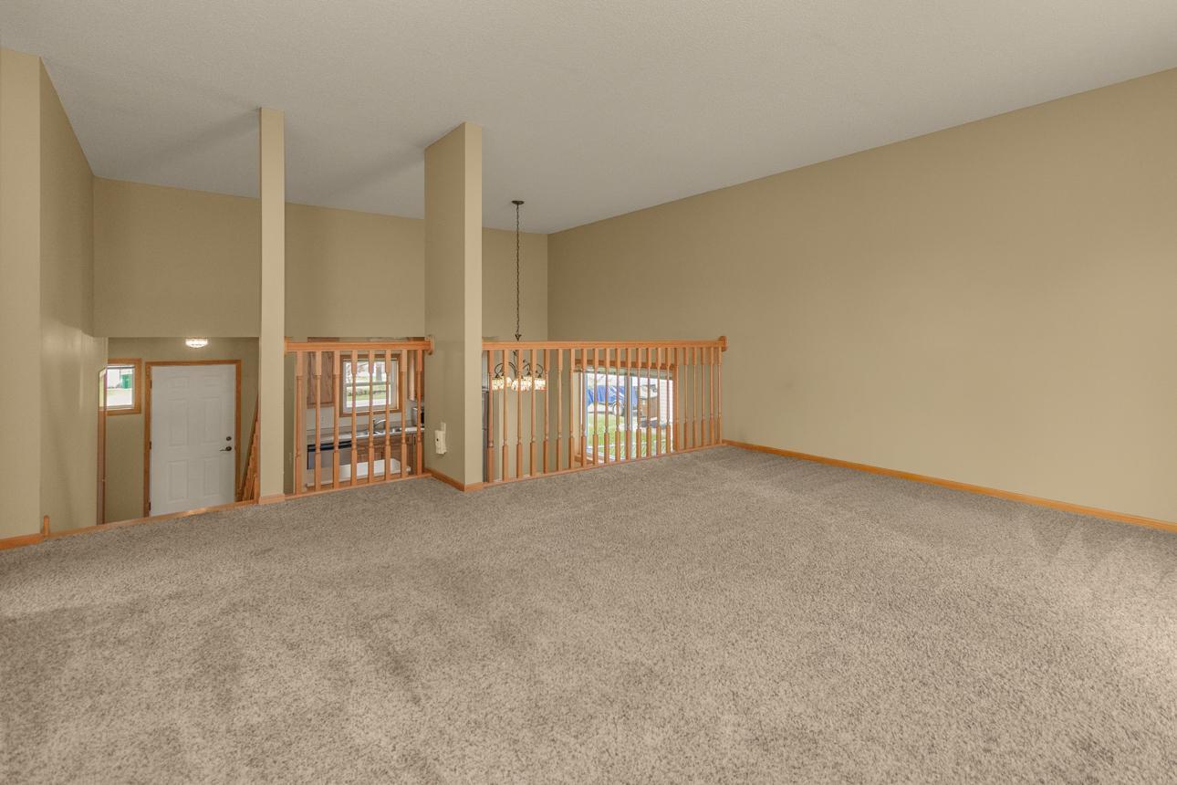 Living Room looking over to Dining , Kitchen and Front Entrance