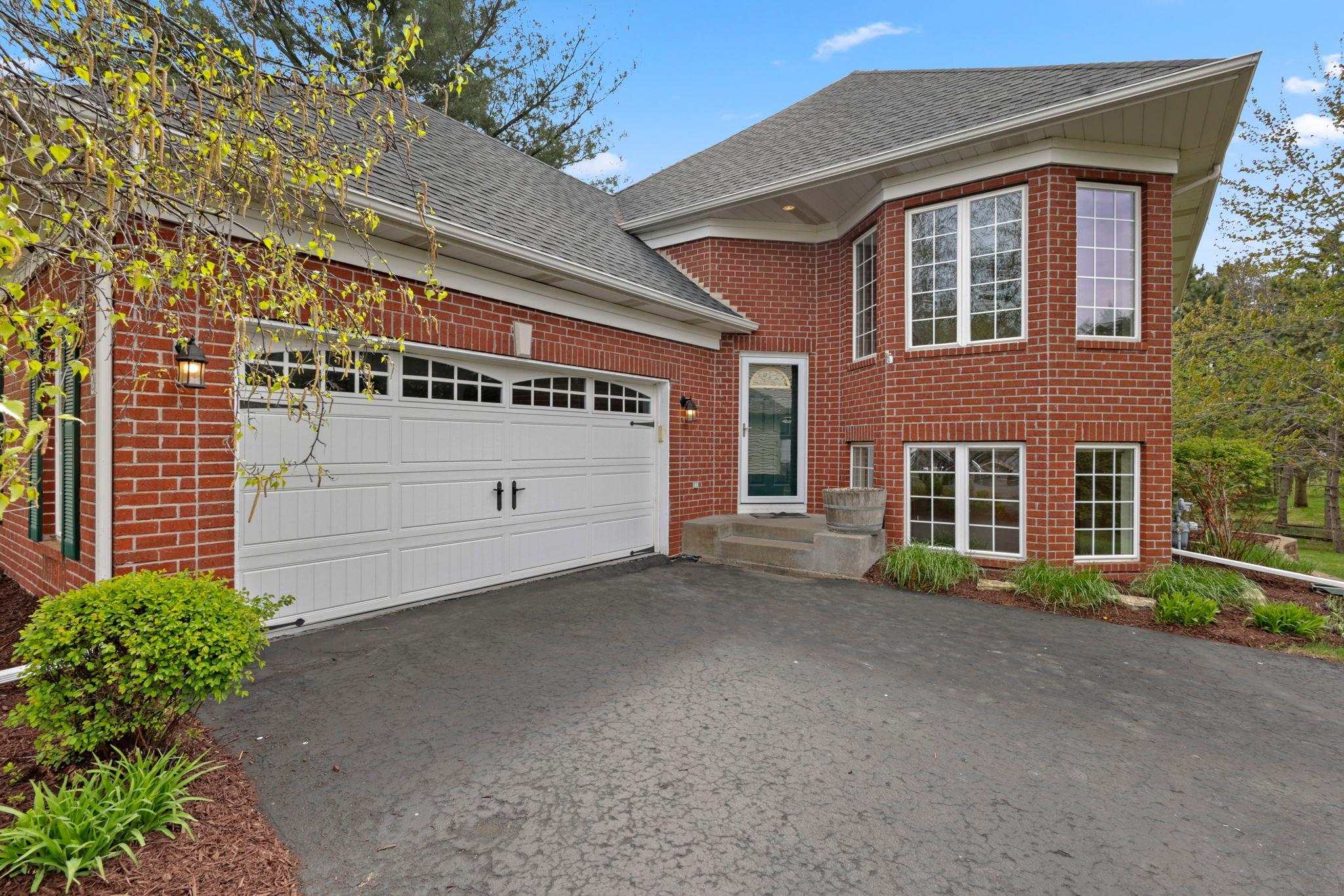 Beautiful trees, landscaping and recently resealed driveway