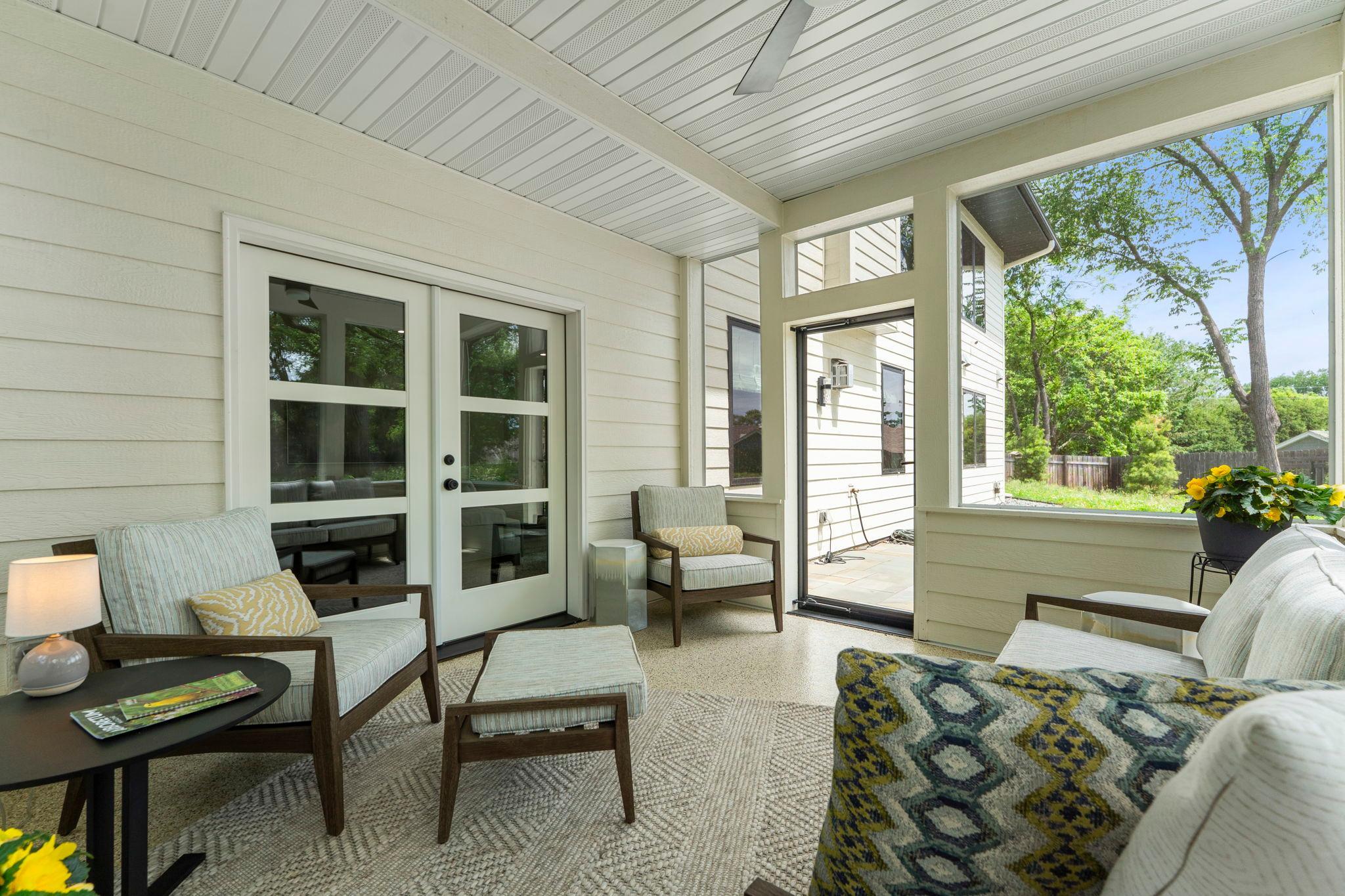 Screen porch walks out to patio