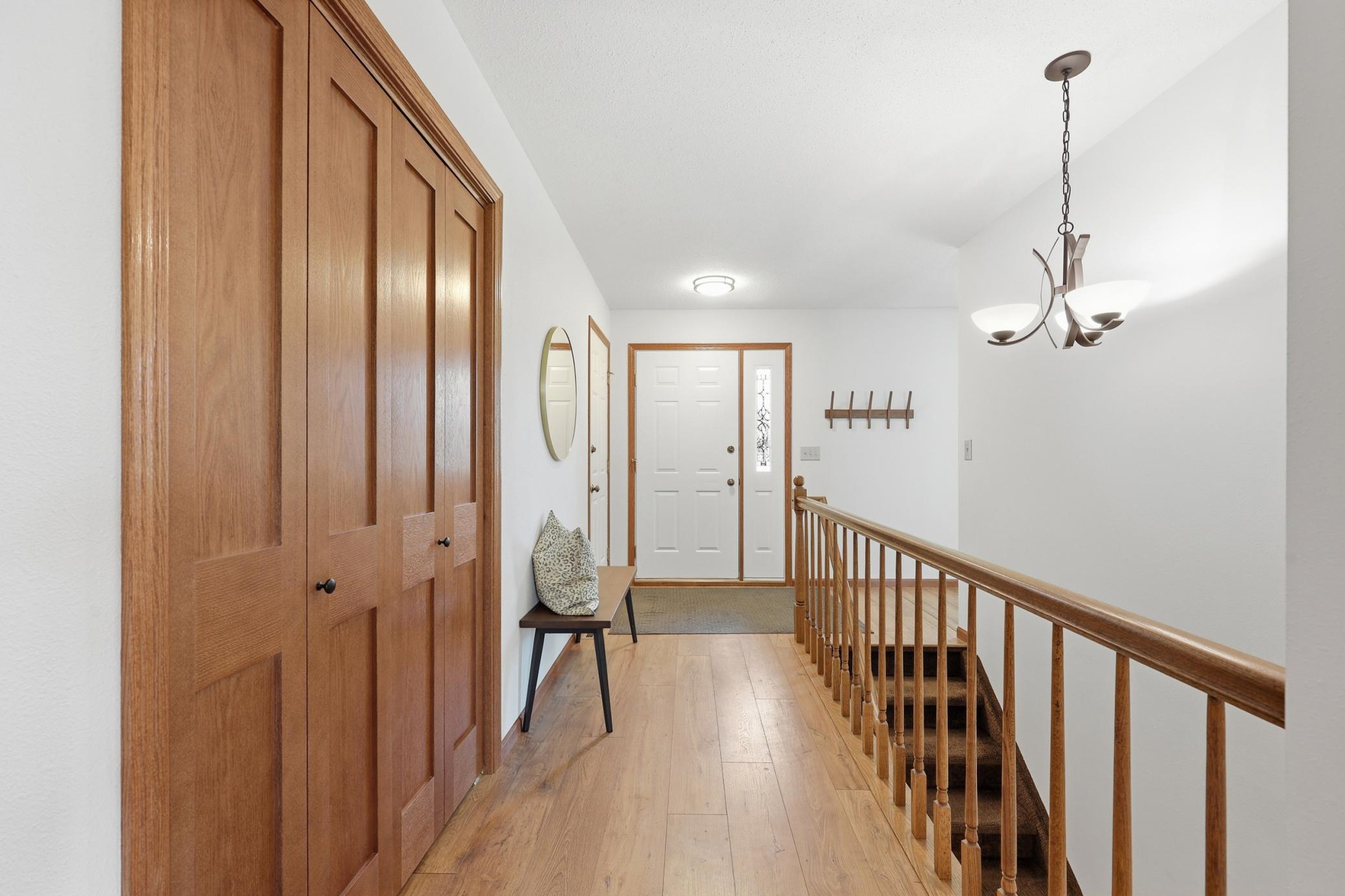 Front Entry with Coat Closet, Updated flooring & Railing