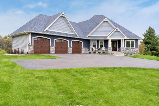Beautiful curb appeal with maintenance-free exterior, oversized heated 3-car garage, professional landscaping, and expansive driveway. Luxury rambler designed for comfort, functionality and modern living.