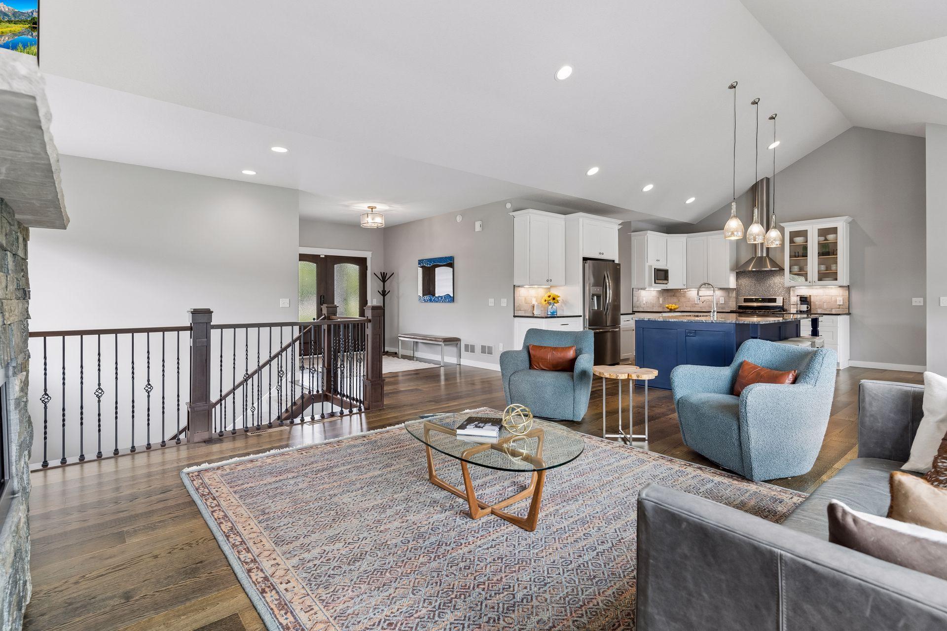 Bright and spacious main living area featuring luxury finishes, custom fireplace and seamless flow to the kitchen and dining spaces. Functional one-level living with elegant design.