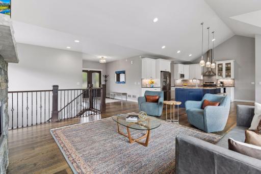 Bright and spacious main living area featuring luxury finishes, custom fireplace and seamless flow to the kitchen and dining spaces. Functional one-level living with elegant design.