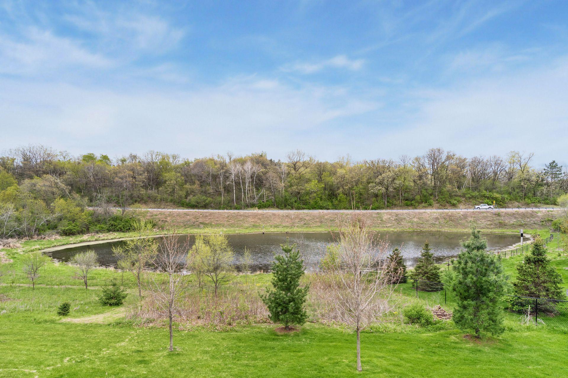 Scenic pond and nature views create a peaceful backyard setting with mature trees and open green space. Private 2.5-acre lot offering beauty, serenity and outdoor enjoyment.