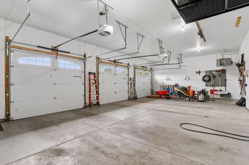 Oversized insulated and heated 3-car garage, built-in storage potential and electric vehicle charging setup. Perfect for cars, hobbies, tools and recreational equipment.
