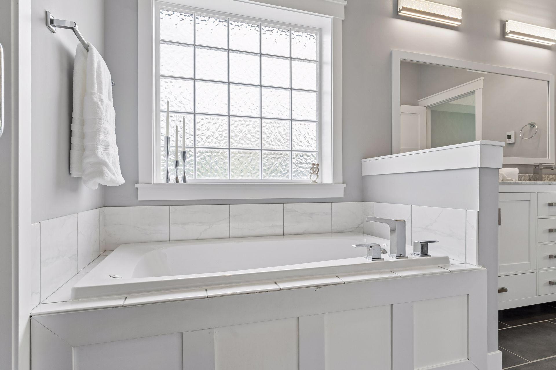 Spa-like primary bathroom with soaking tub, large vanity and luxury finishes. Designed for relaxation, comfort, and everyday convenience.