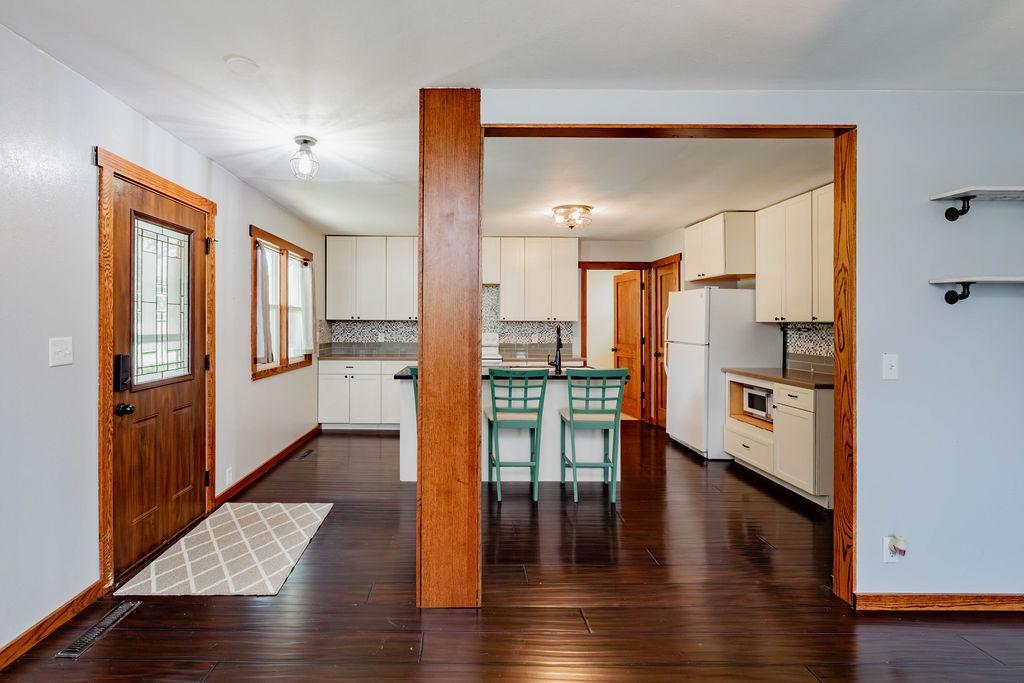 Front entry to open-concept kitchen, dining and living areas