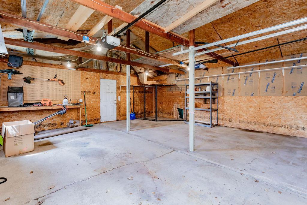 Garage is insulated, heated, lighted with access to backyard & alley.