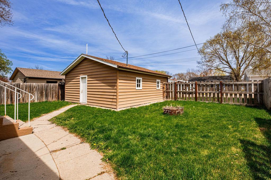 Backyard has a full privacy fence