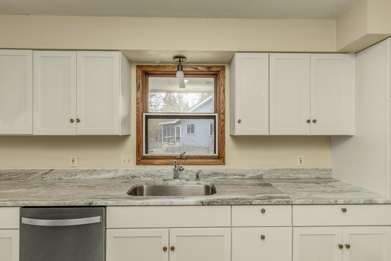 Brand new granite counter top with new sink.