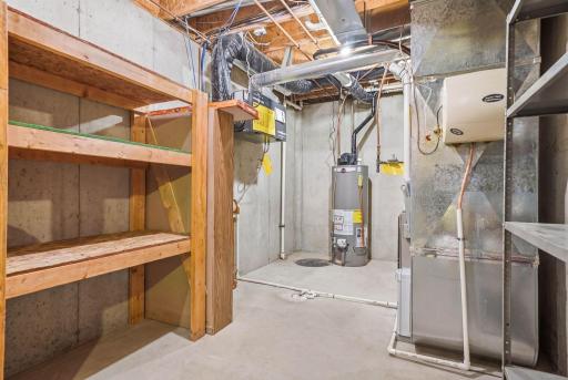 Lower level unfinished storage area with built in shelving