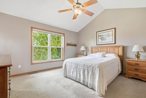 Primary bedroom with large vaulted ceiling