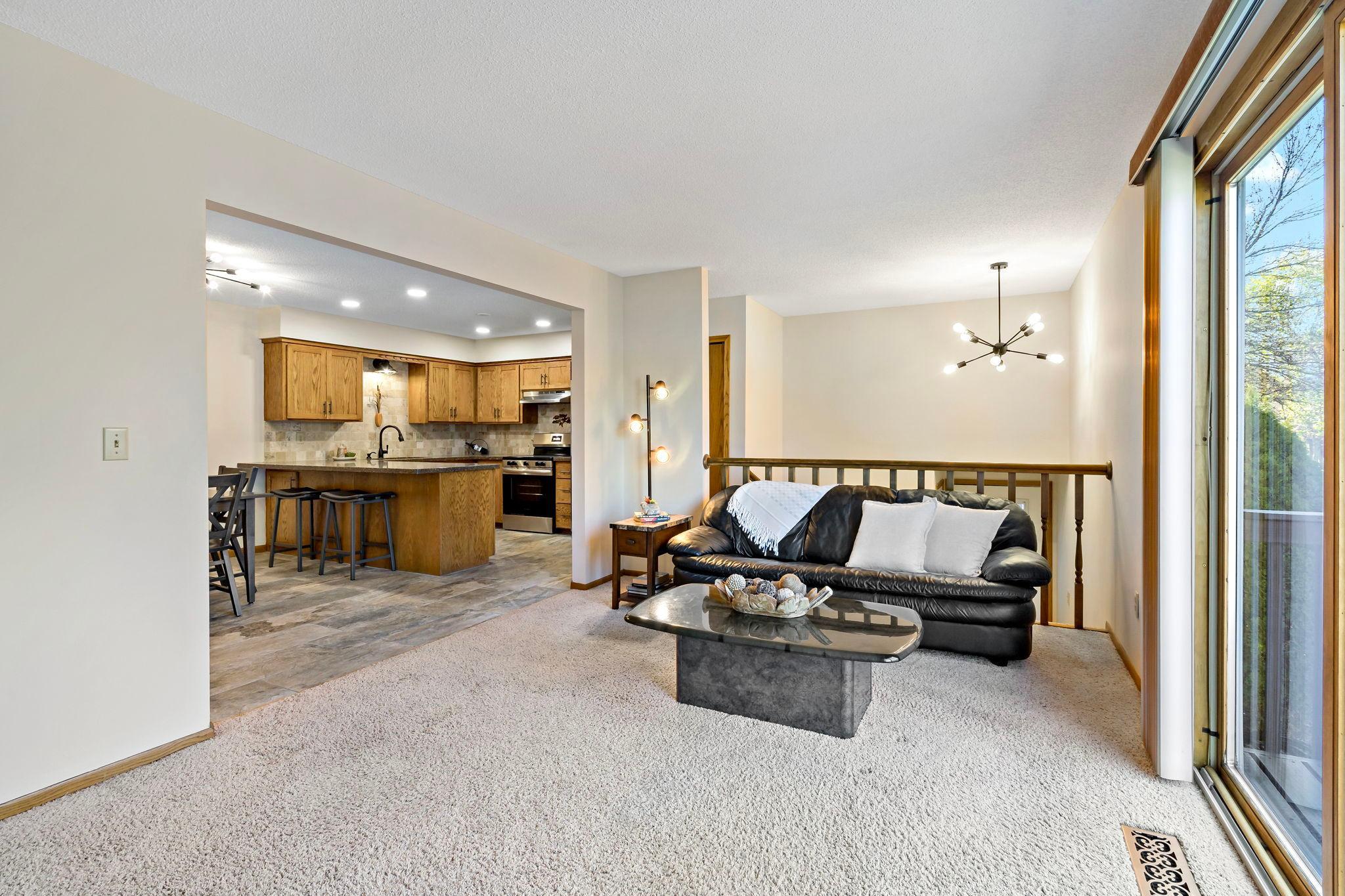 Living room open concept to kitchen and dining