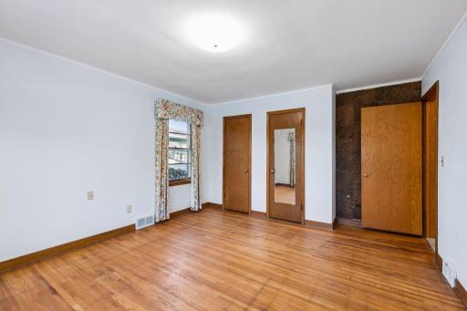 Second main floor bedroom with hardwood floors and dual windows for tons of natural light!