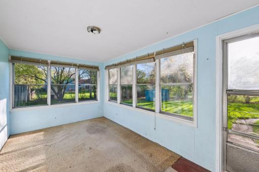 The back porch provides direct access to the expansive backyard, seamlessly extending your living and entertaining space outdoors.