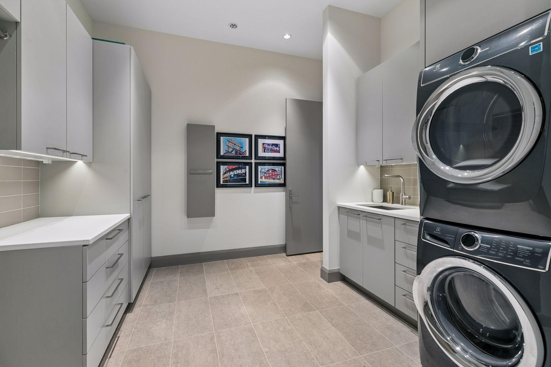 Spacious laundry room with back entry to the hallway