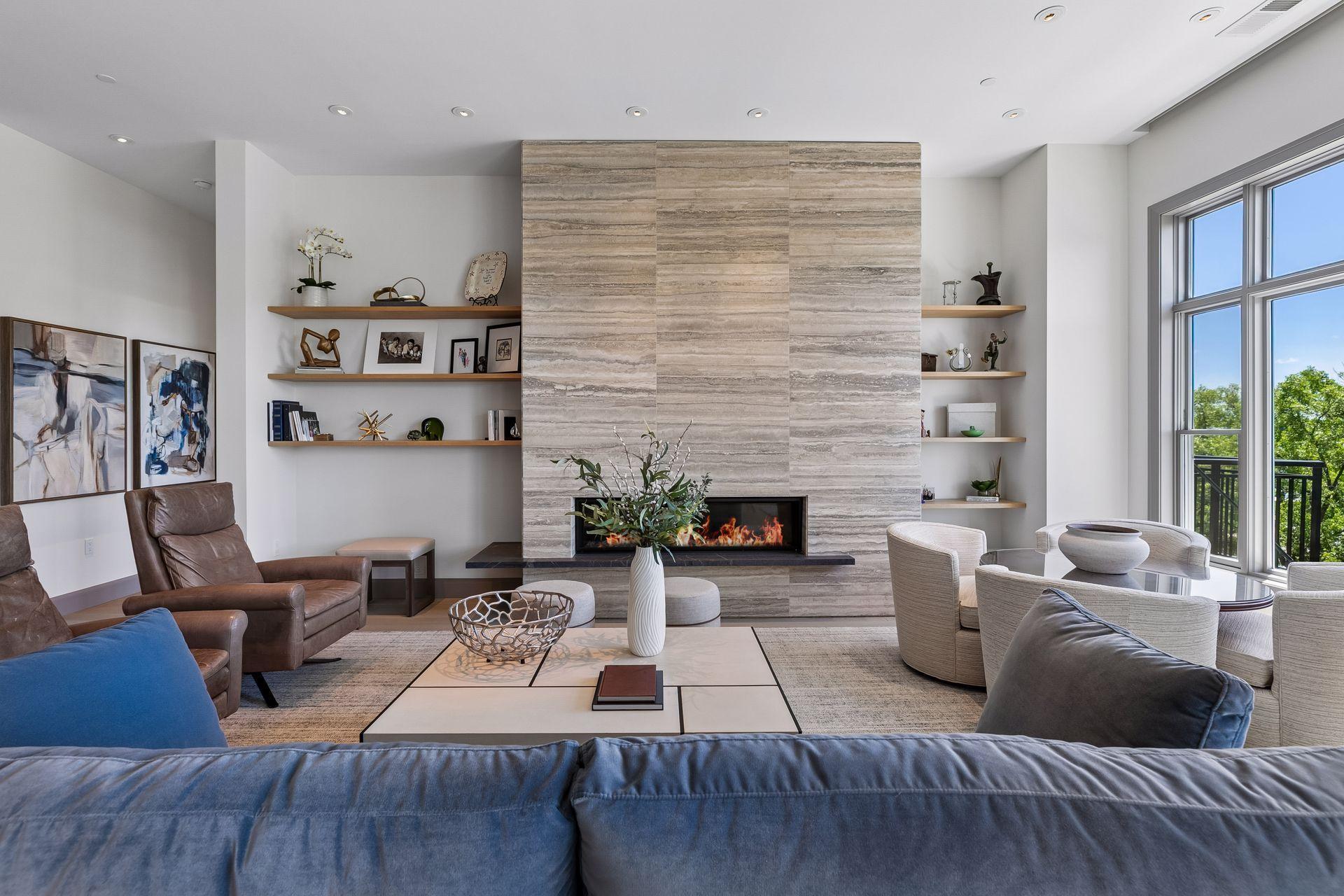 Floating shelves on both sides of the fireplace allow for extra storage or displaying your favorite decor