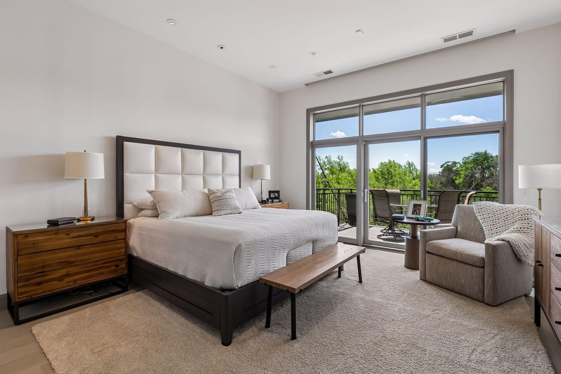 Step into the luxurious primary bedroom with access to the second balcony