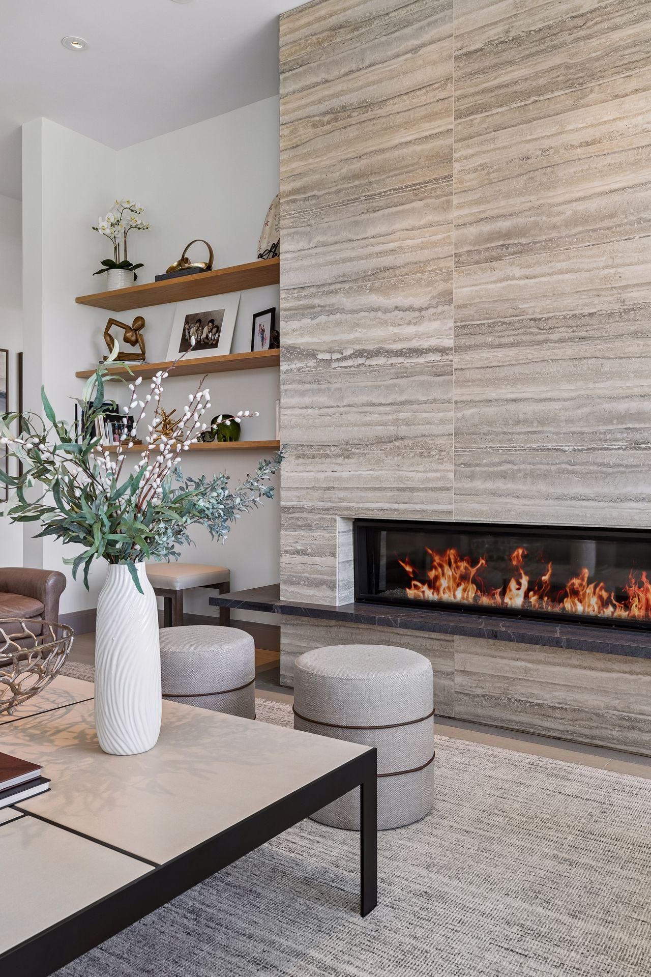 Striking floor to ceiling slab/tile with a linear fireplace
