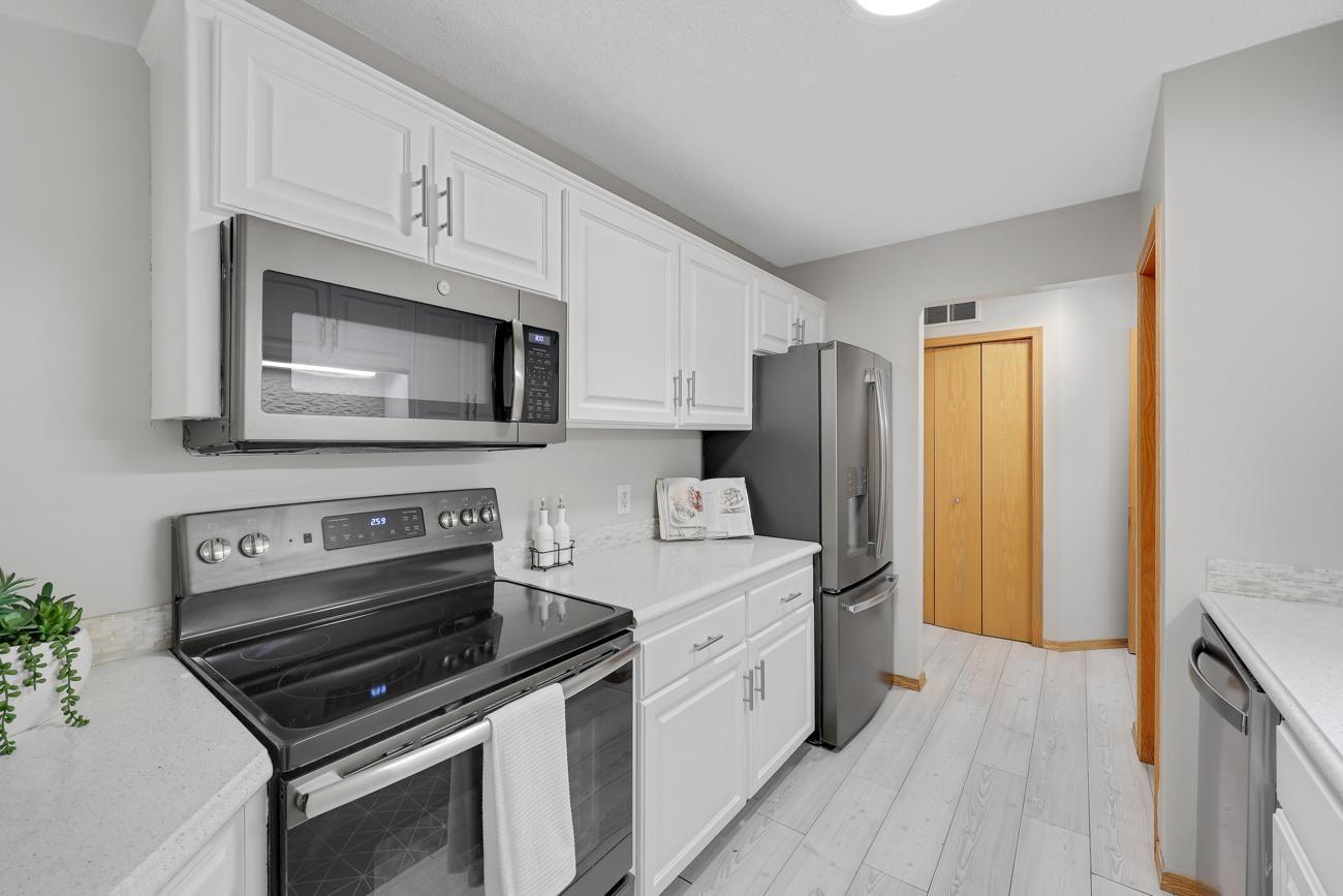 Newer SS Appliances, gorgeous quartz countertops & walk-in pantry.