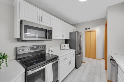 Newer SS Appliances, gorgeous quartz countertops & walk-in pantry.