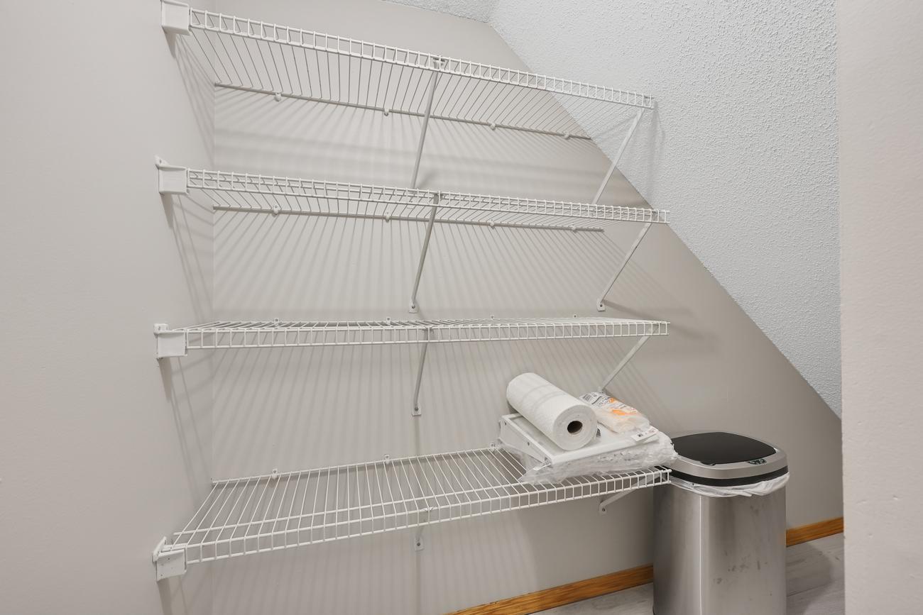 Walk-in pantry off kitchen.