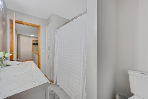 Upper level full bathroom with pass through to primary bedroom.
