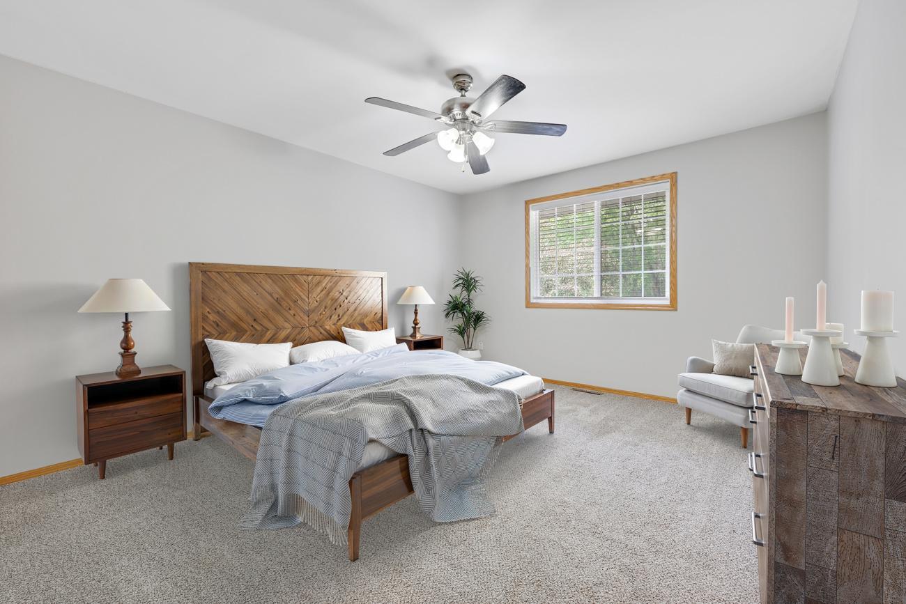 Spacious primary bedroom with walk-in closet.